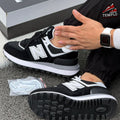NEW BALANCE 574 NEGRA GRIS