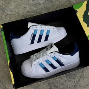 ADIDAS SUPERSTAR BLANCA CELESTE DAMA ADIDAS SUPERSTAR BLANCA CELESTE